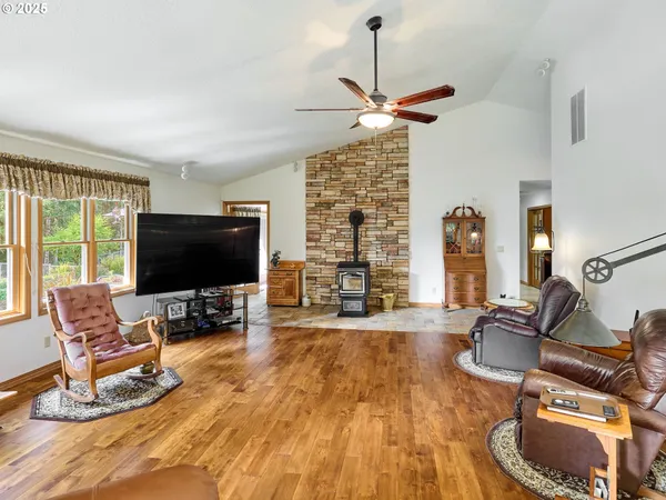 a bedroom with furniture and a flat screen tv