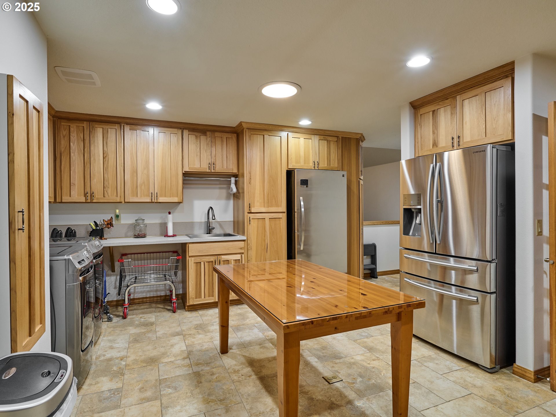 23456 South Schieffer Road Colton, OR 97017 - Photo 26 of 48 a kitchen with kitchen island granite countertop stainless steel appliances a refrigerator a stove a sink cabinets and a dining table