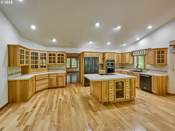 a spacious bathroom with a mirror a sink and a mirror
