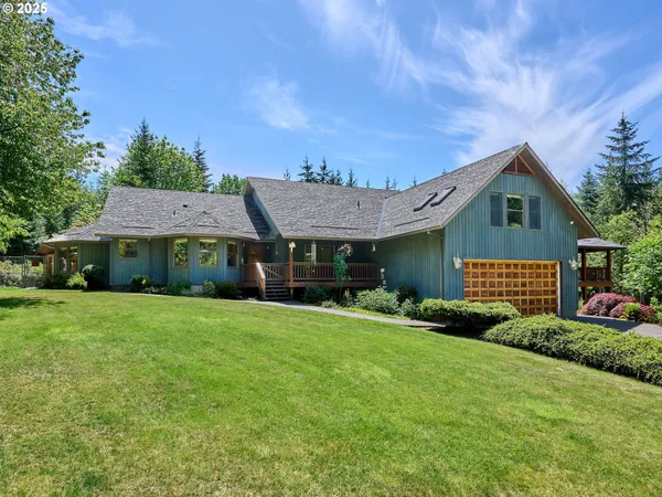 a view of a house with a big garden and plants