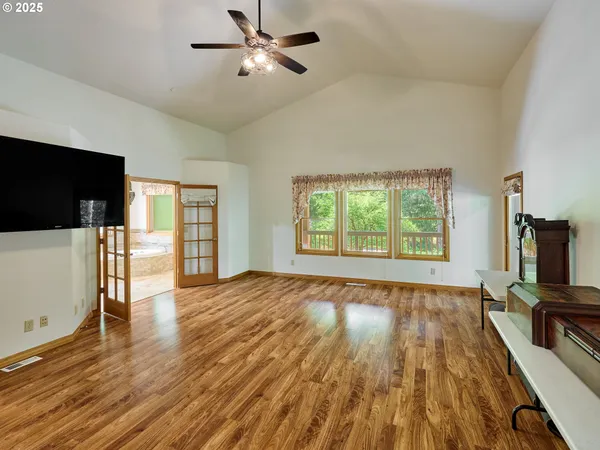 a view of a livingroom with furniture and a flat screen tv