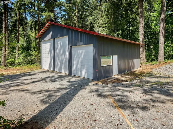 a backyard of a house with large trees