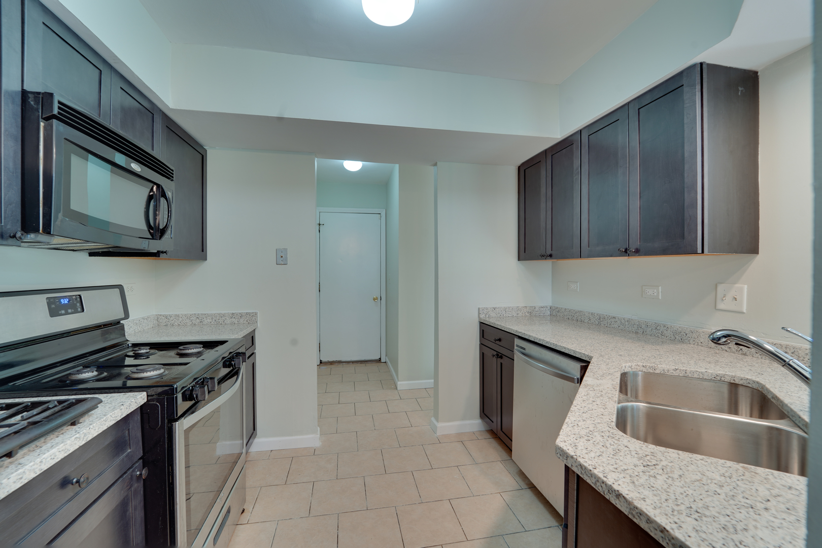 89 King Drive Streamwood, IL 60107 - Photo 13 of 13 a kitchen that has a sink and a stove in it
