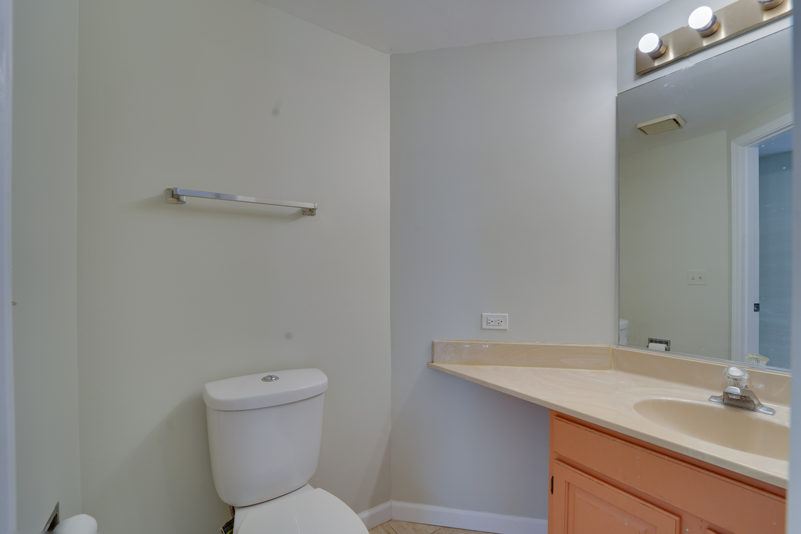 89 King Drive Streamwood, IL 60107 - Photo 6 of 13 a bathroom with a granite countertop sink a toilet and a mirror