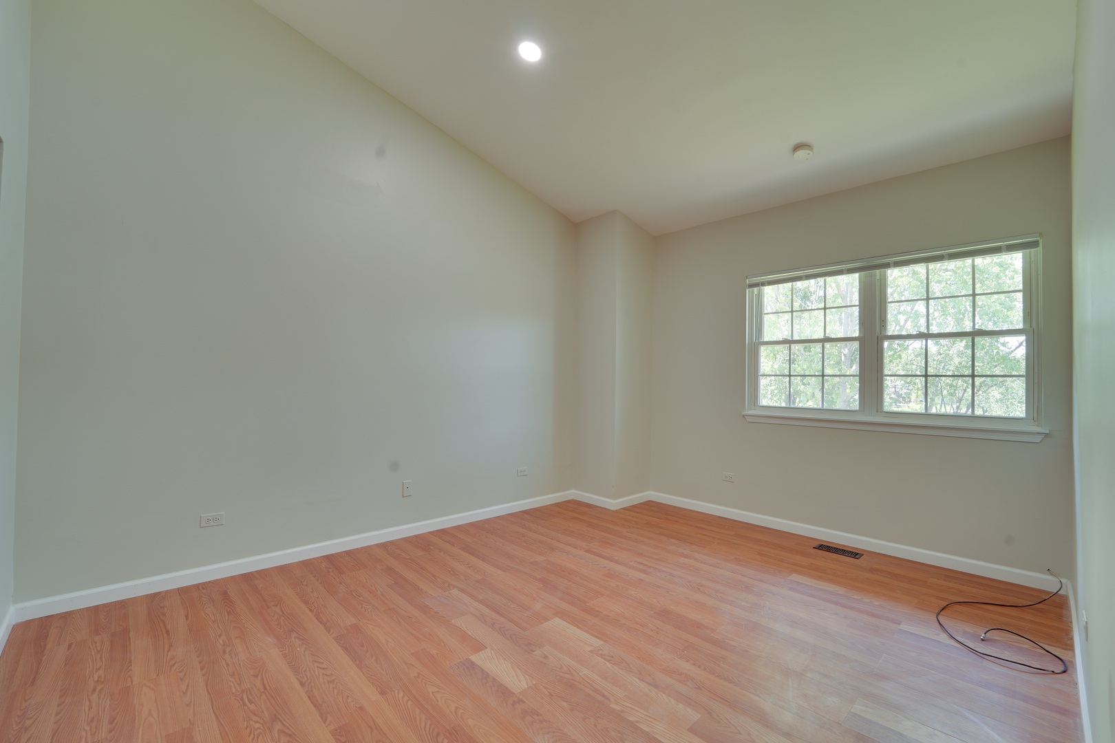 89 King Drive Streamwood, IL 60107 - Photo 7 of 13 an empty room with wooden floor and windows