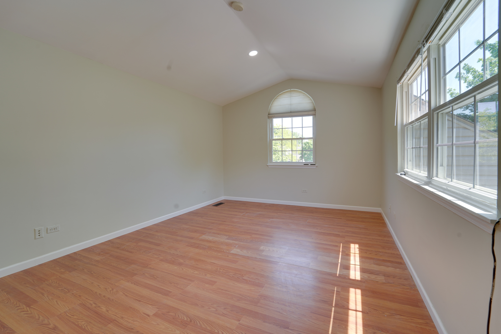 89 King Drive Streamwood, IL 60107 - Photo 9 of 13 a view of an empty room with wooden floor and a window