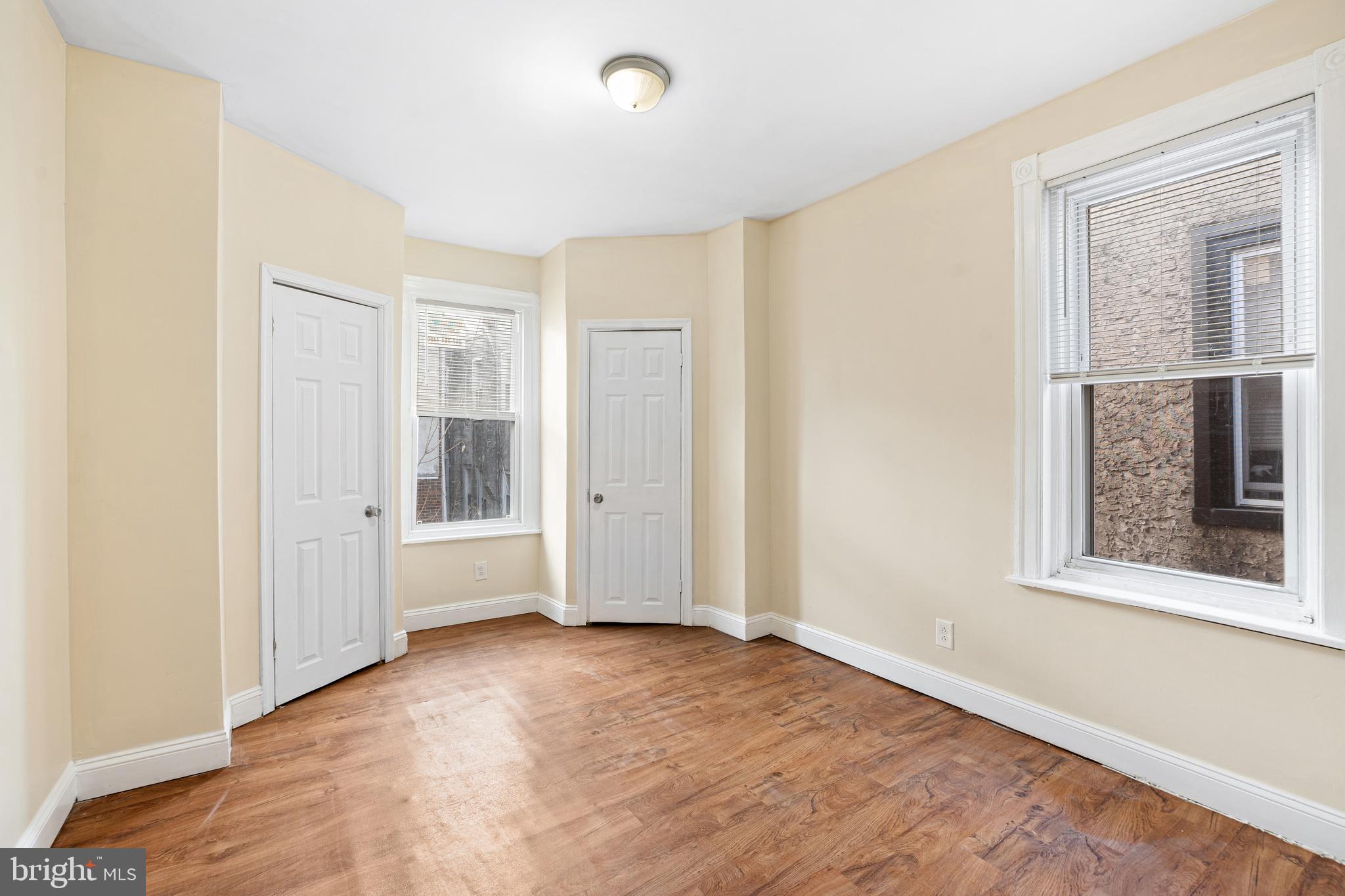 5538 Addison Street Philadelphia, PA 19143 - Photo 5 of 15 an empty room with windows and closet