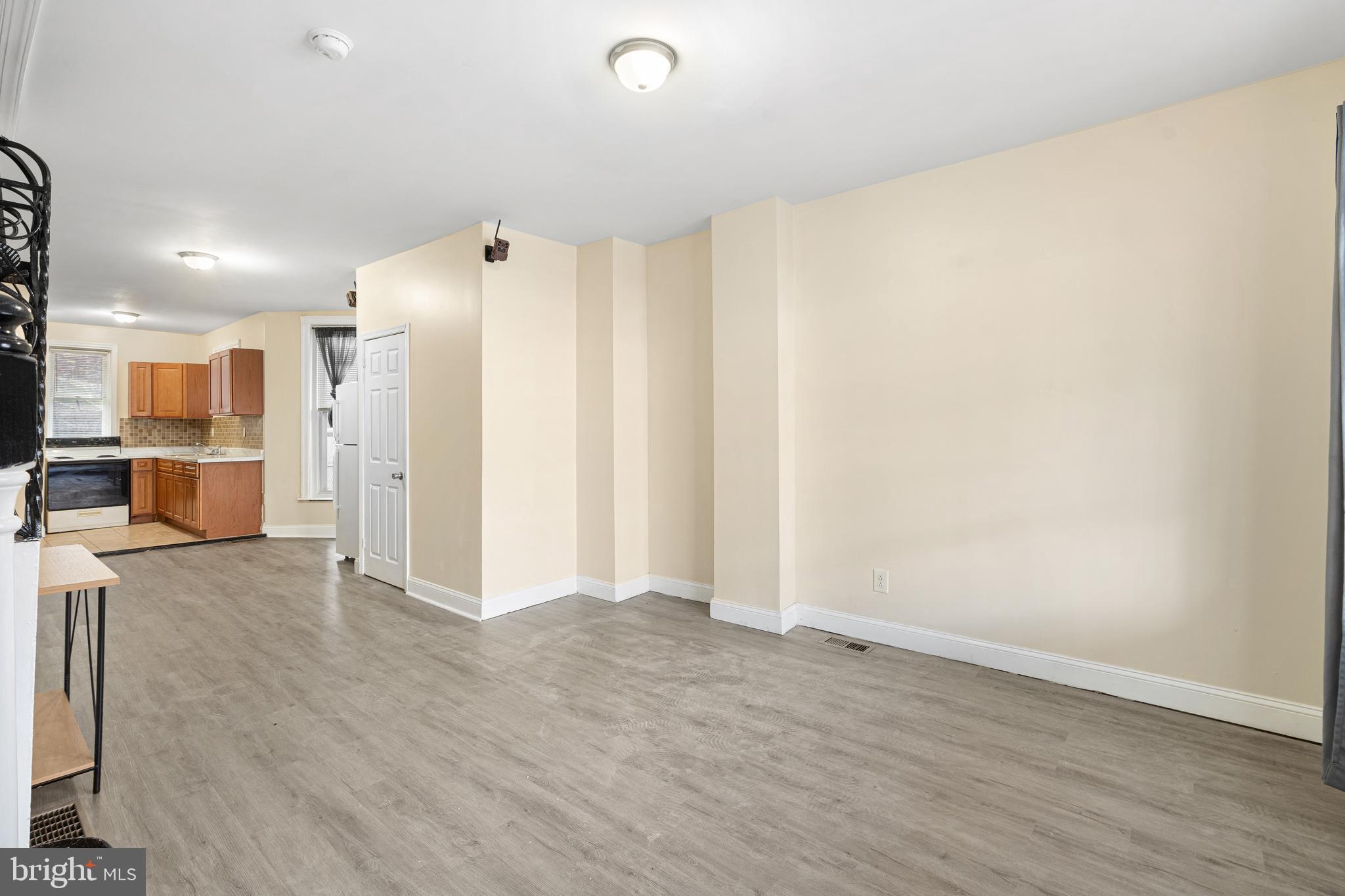 5538 Addison Street Philadelphia, PA 19143 - Photo 8 of 15 a view of a big room with wooden floor and a window