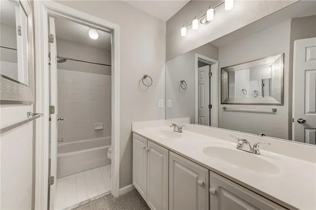 a view of a livingroom with a ceiling fan and window