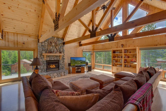 16073 Matt's Mountain Place Truckee, CA 96161 - Photo 4 of 14 a living room with furniture a fireplace and a ceiling fan