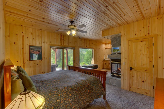 16073 Matt's Mountain Place Truckee, CA 96161 - Photo 9 of 14 a bed room with a bed and a chandelier