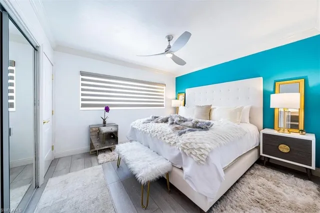 a bedroom with a bed and window