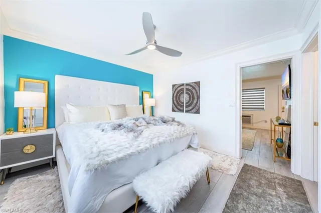 a living room with a bed and a table