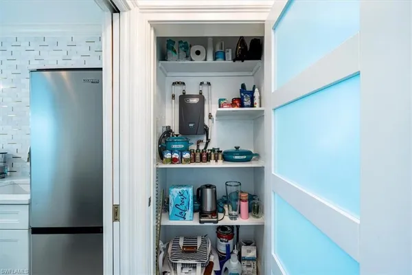 a shelf with books and knick knacks on it