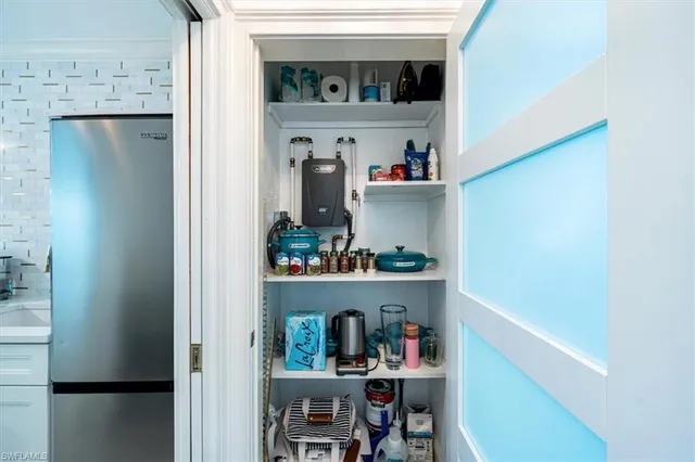 a shelf with books and knick knacks on it