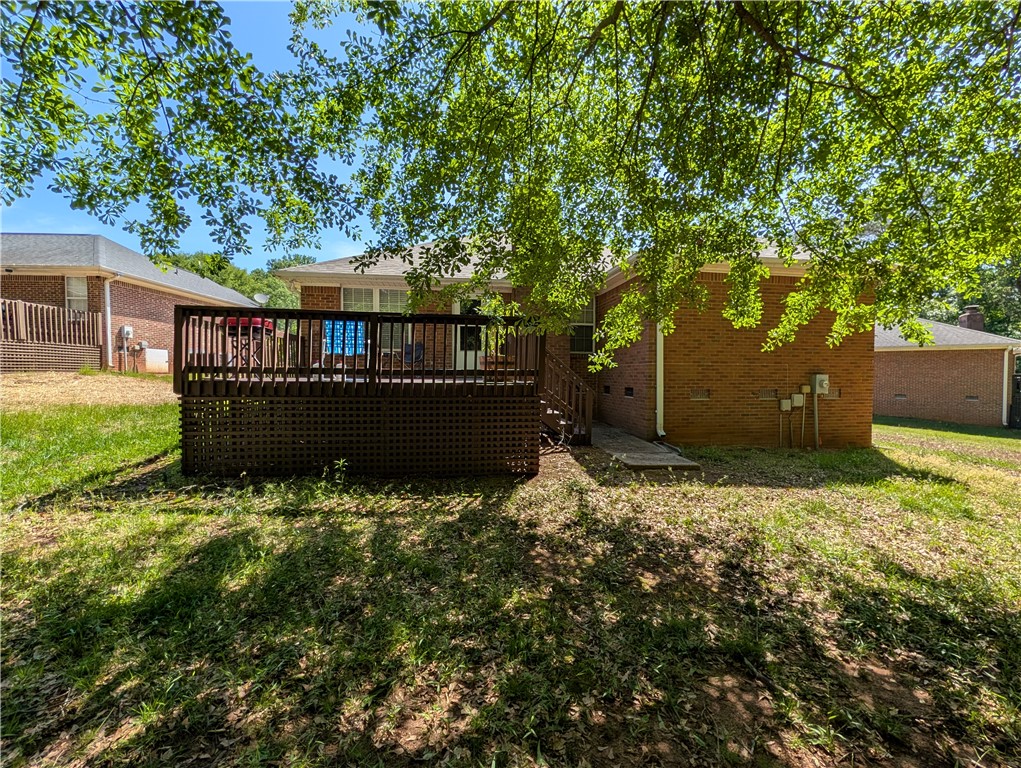 124 Woodbridge Court Anderson, SC 29621 - Photo 5 of 15 This charming residence features a spacious rear deck, perfect for outdoor enjoyment and relaxation.