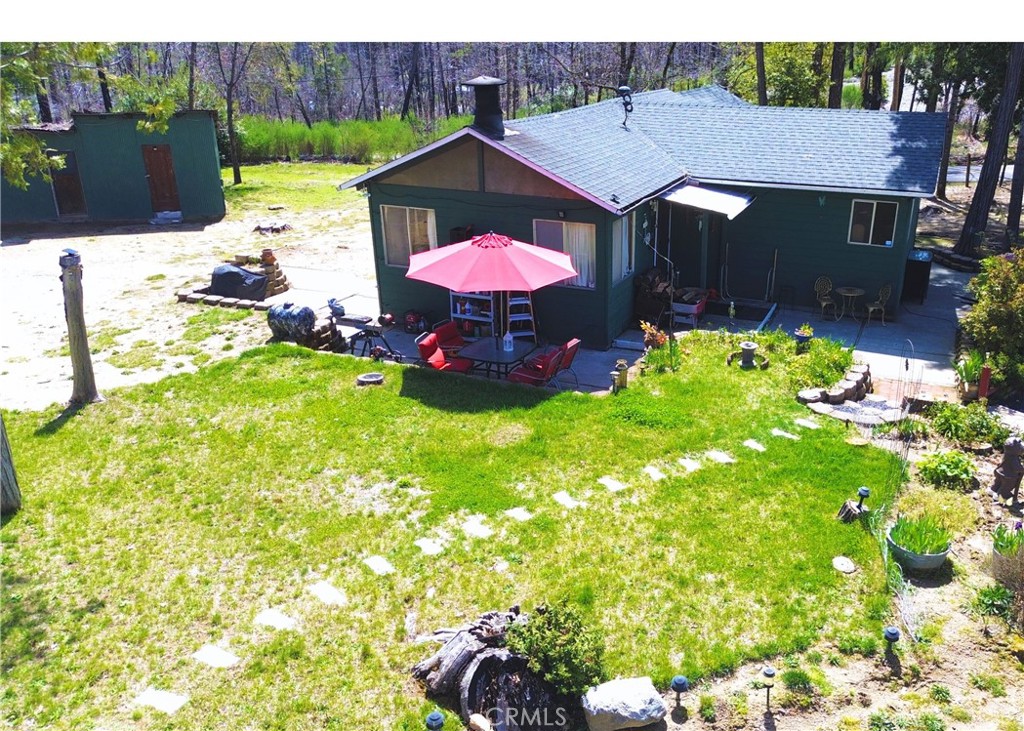 1171 Bald Rock Road Berry Creek, CA 95916 - Photo 12 of 20 a view of a house with a yard and sitting area