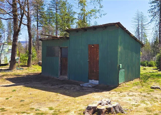 a view of backyard with a patio
