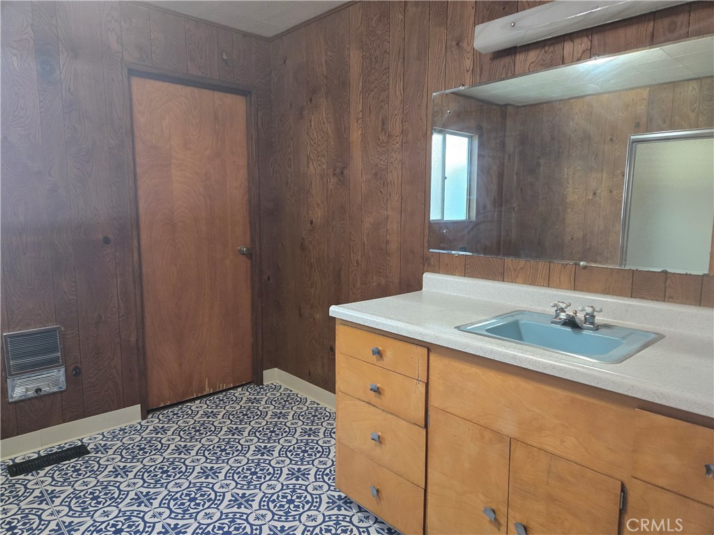 1171 Bald Rock Road Berry Creek, CA 95916 - Photo 9 of 20 a bathroom with a granite countertop sink and a mirror