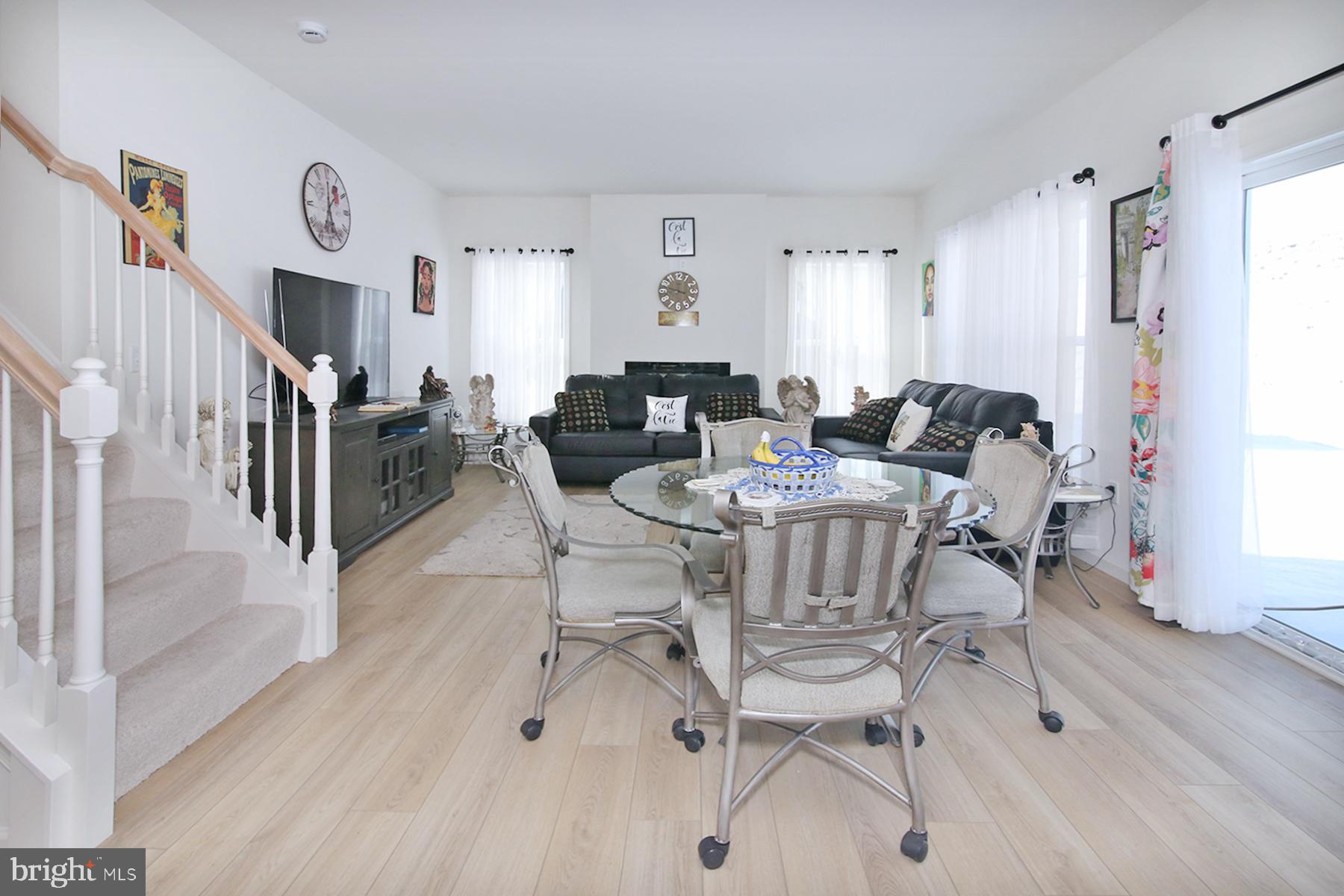 216 Copper Ridge Drive Newmanstown, PA 17073 - Photo 13 of 45 a living room with fireplace furniture and a wooden floor