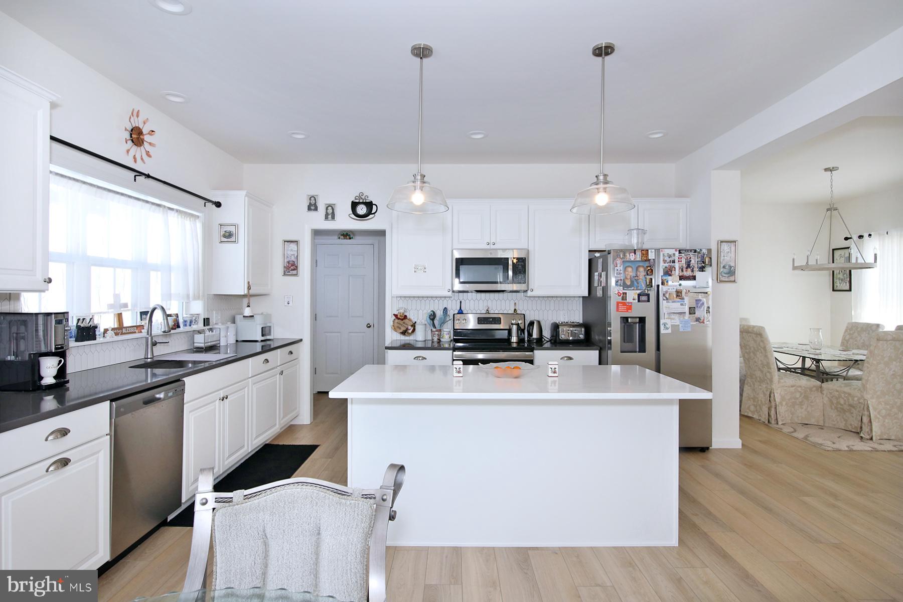 216 Copper Ridge Drive Newmanstown, PA 17073 - Photo 16 of 45 a large kitchen with kitchen island a sink a stove a refrigerator and a cabinets