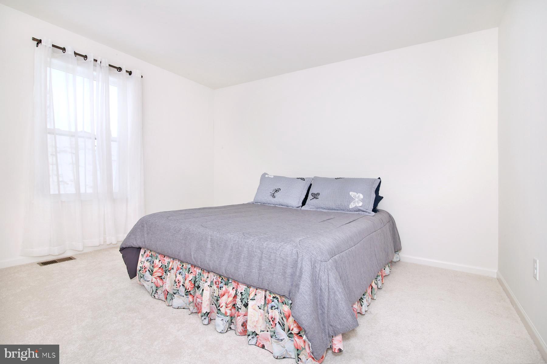 216 Copper Ridge Drive Newmanstown, PA 17073 - Photo 25 of 45 a bedroom with a bed and a window