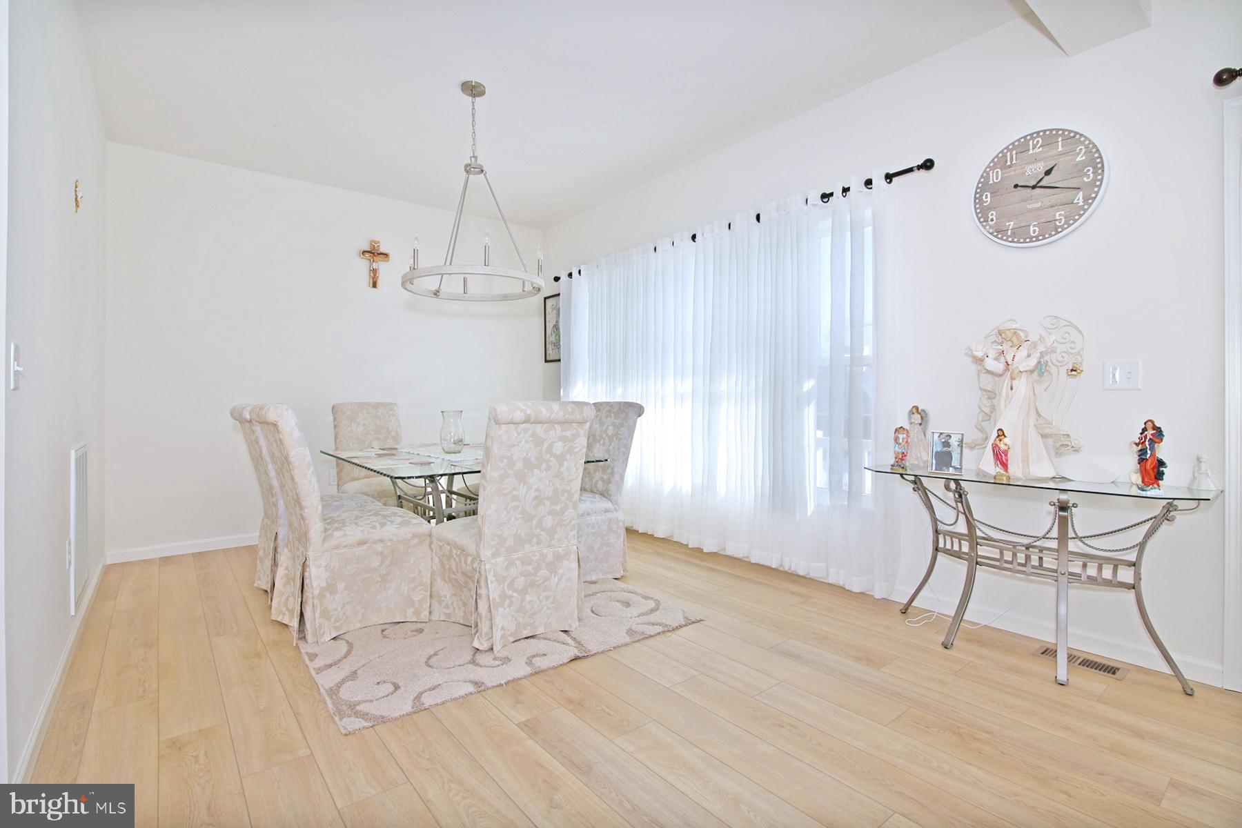 216 Copper Ridge Drive Newmanstown, PA 17073 - Photo 10 of 45 a view of a dining room with furniture window and wooden floor