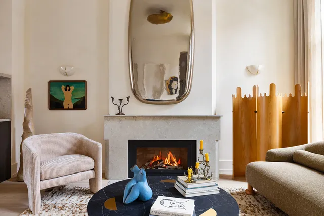 a living room with furniture and a fireplace