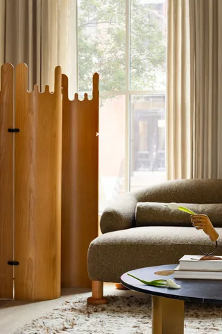 a living room with furniture and a window