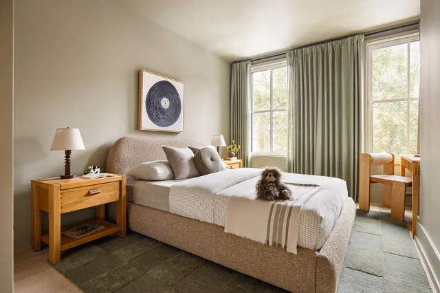 a bedroom with bed and a window