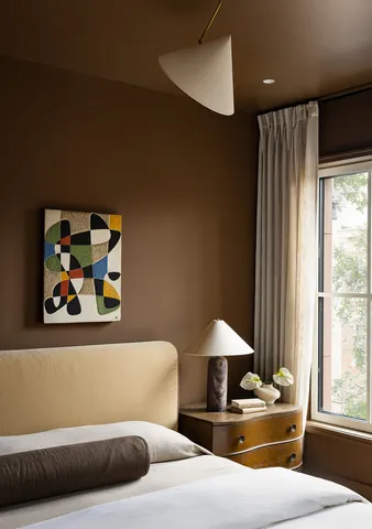 a bedroom with furniture and window