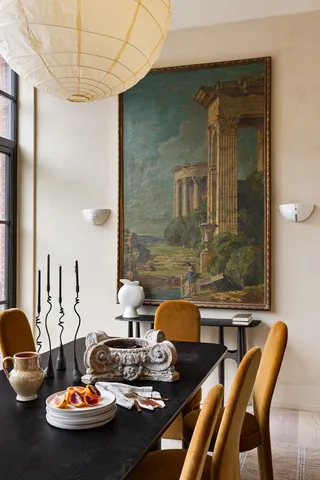 a living room with furniture and a kitchen view