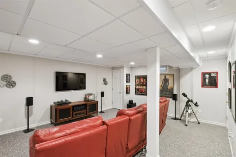 a room with furniture and air hockey table