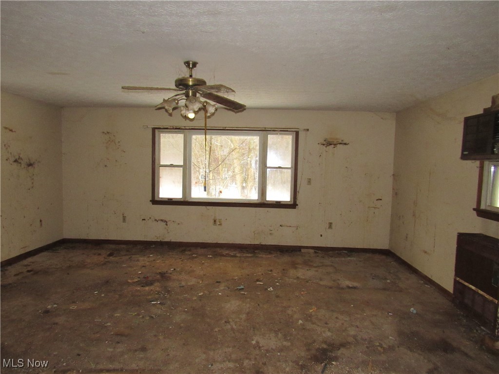 3813 Ranfield Road Kent, OH 44240 - Photo 9 of 24 Unfurnished room featuring a textured ceiling and ceiling fan