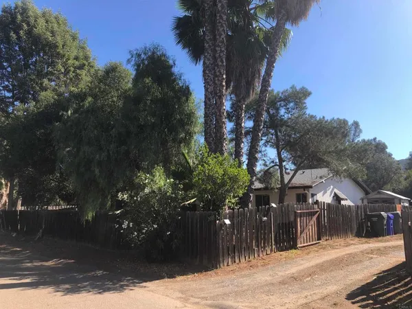a view of a house with a tree