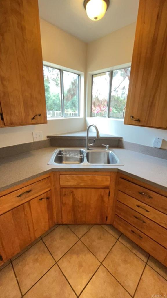 2005-07 Camino Rainbow Fallbrook, CA 92028 - Photo 12 of 65 a kitchen with granite countertop a sink and a window