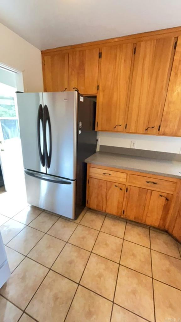 2005-07 Camino Rainbow Fallbrook, CA 92028 - Photo 14 of 65 a kitchen with granite countertop a refrigerator a stove and a sink