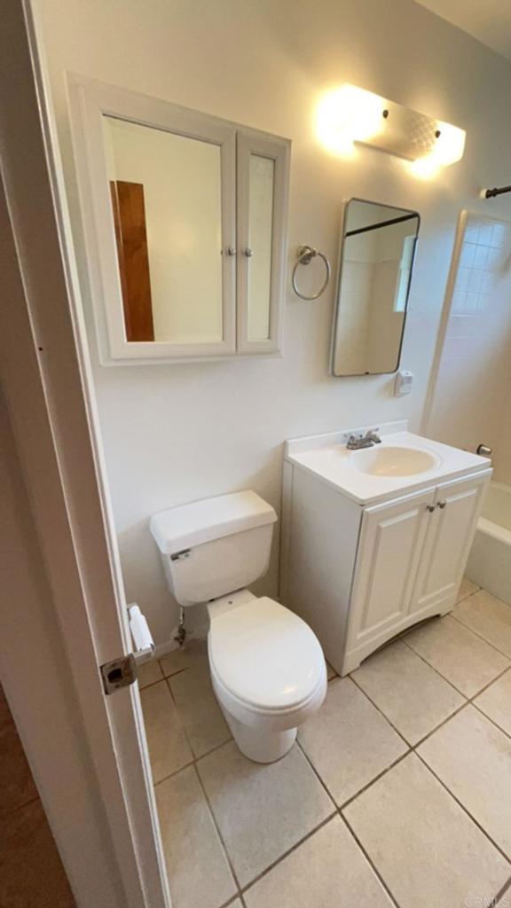 2005-07 Camino Rainbow Fallbrook, CA 92028 - Photo 25 of 65 a white toilet sitting next to a bathroom sink and a mirror