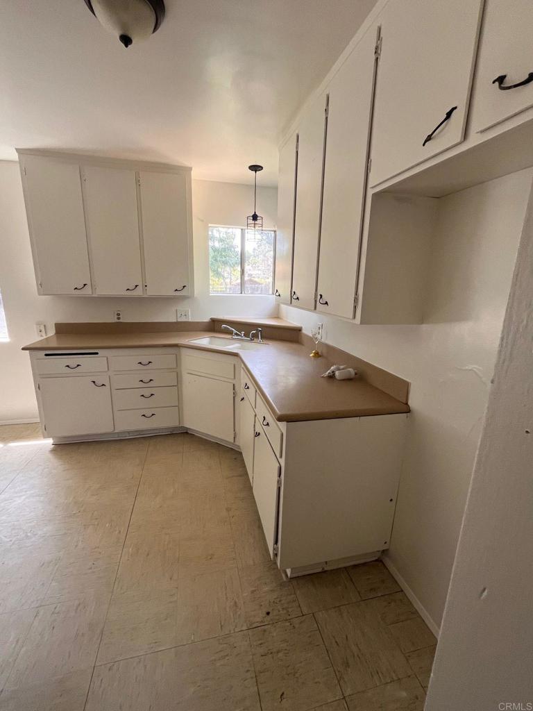 2005-07 Camino Rainbow Fallbrook, CA 92028 - Photo 43 of 65 a kitchen with a sink and cabinets