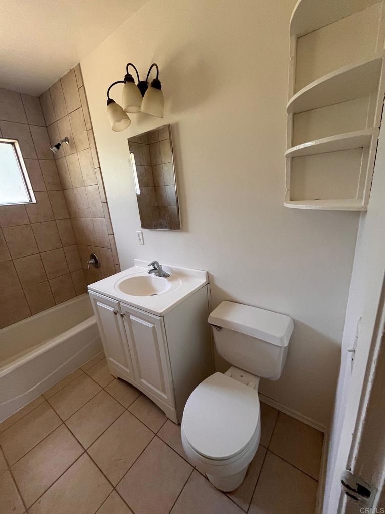 2005-07 Camino Rainbow Fallbrook, CA 92028 - Photo 51 of 65 a bathroom with a white toilet sitting next to a bathroom sink and a mirror