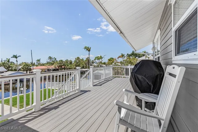 a view of a balcony with chairs