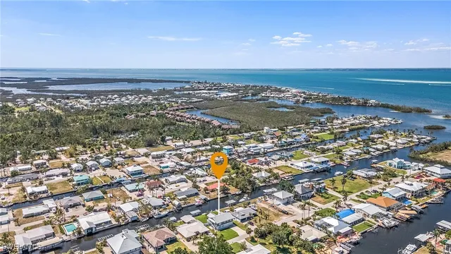 an aerial view of residential building and ocean