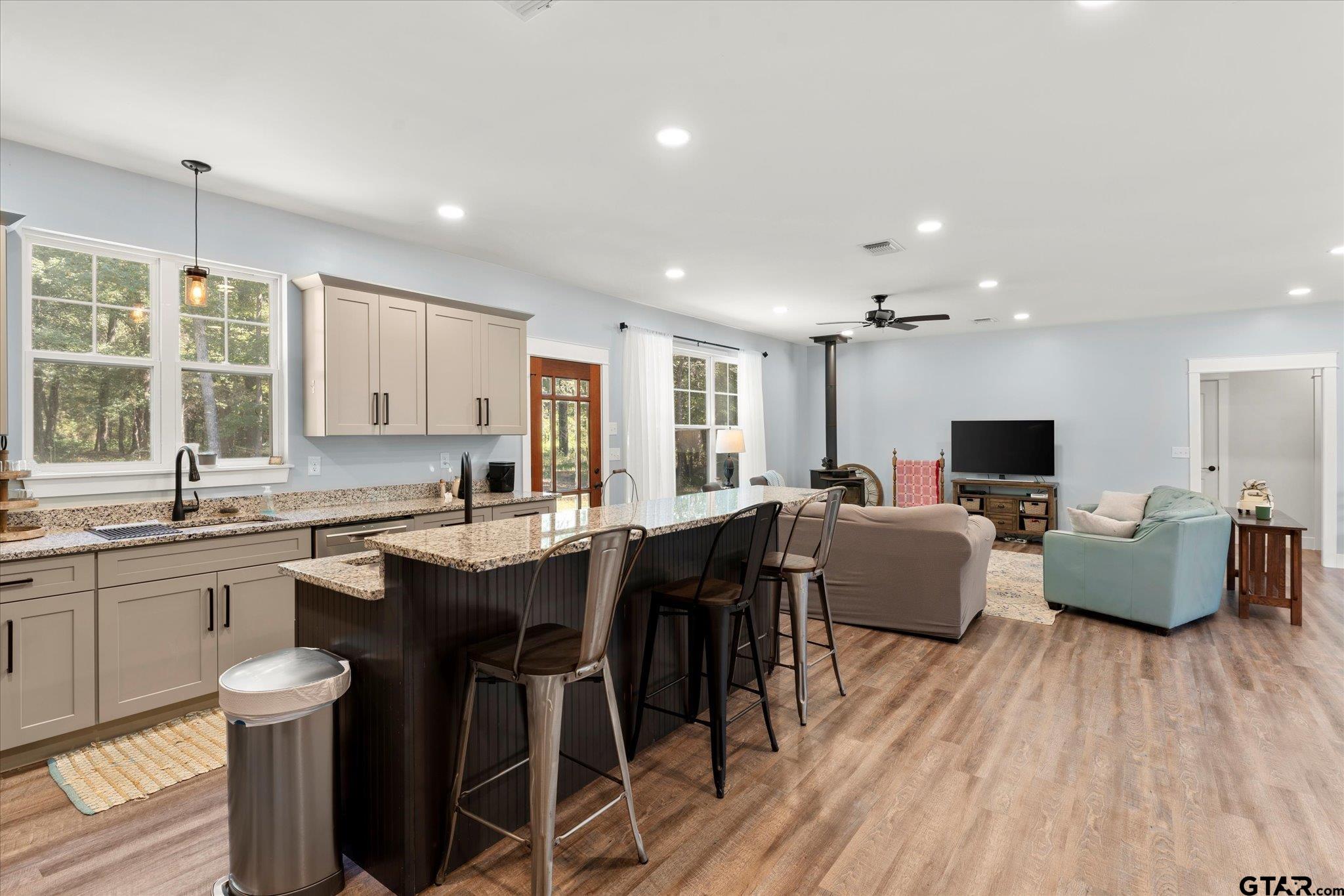 1663 County Road 4510 Pittsburg, TX 75686 - Photo 12 of 34 a large kitchen with a table and chairs