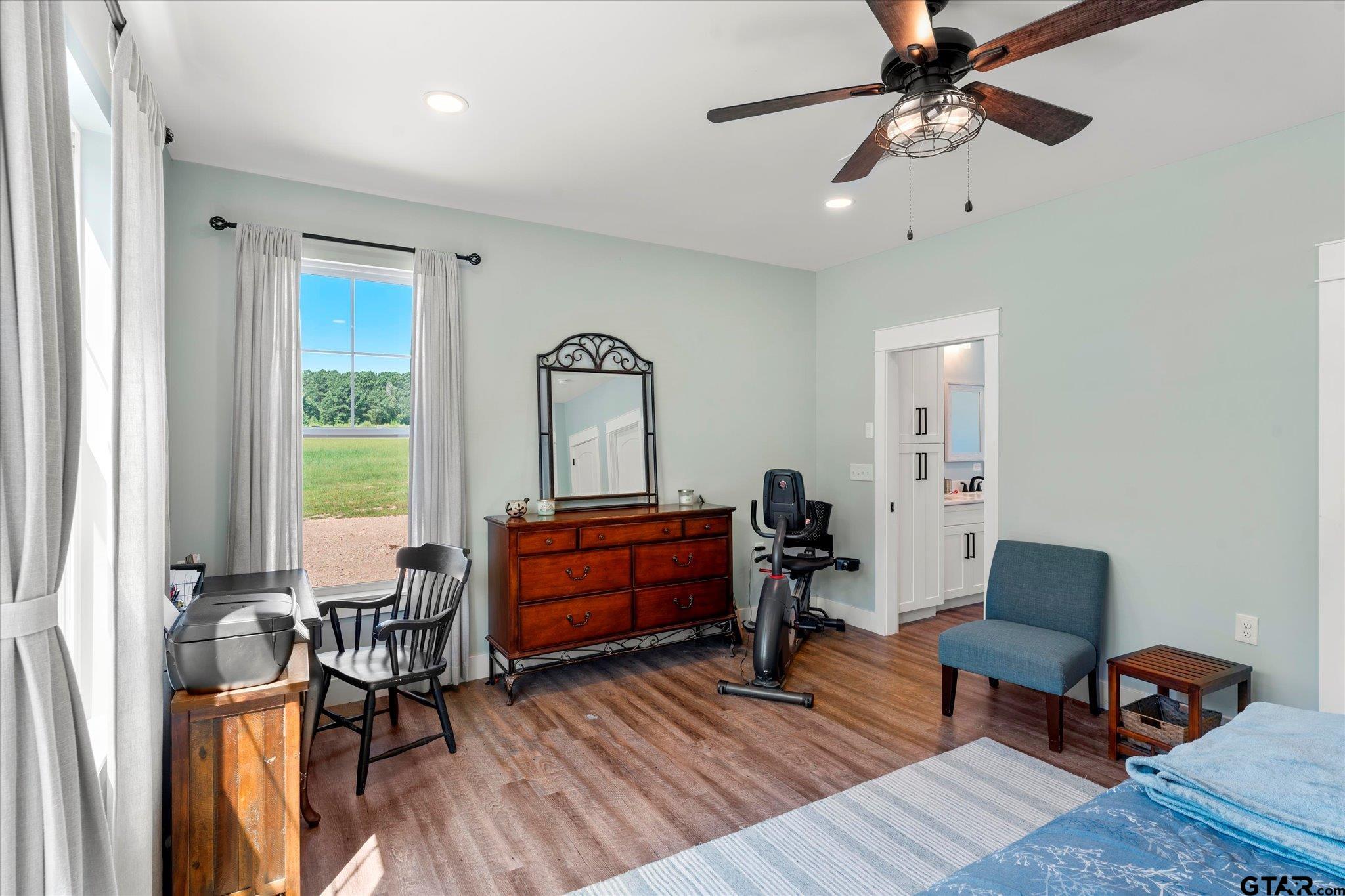 1663 County Road 4510 Pittsburg, TX 75686 - Photo 22 of 34 a living room with furniture and a wooden floor