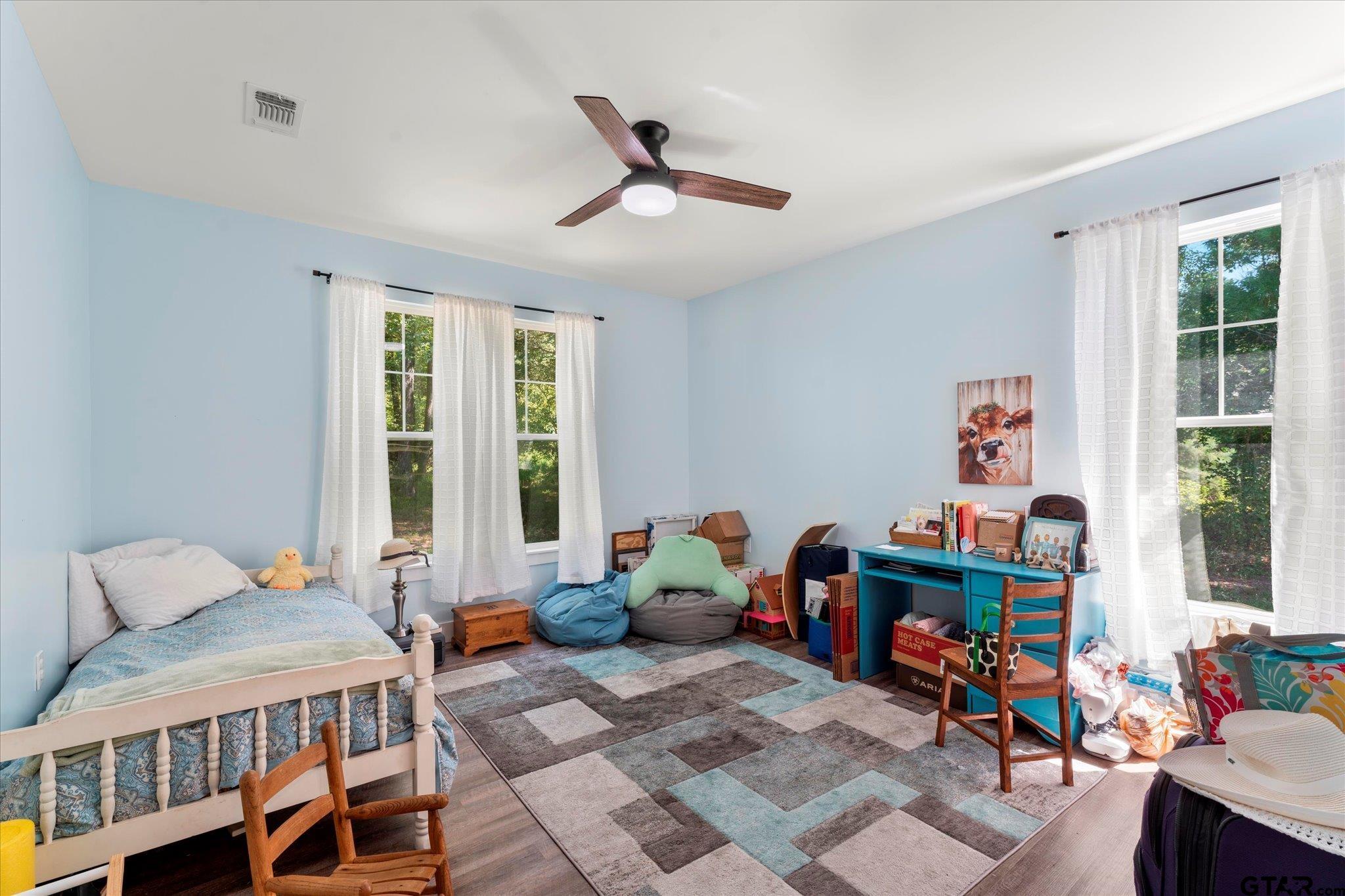 1663 County Road 4510 Pittsburg, TX 75686 - Photo 25 of 34 a bedroom with furniture and a window