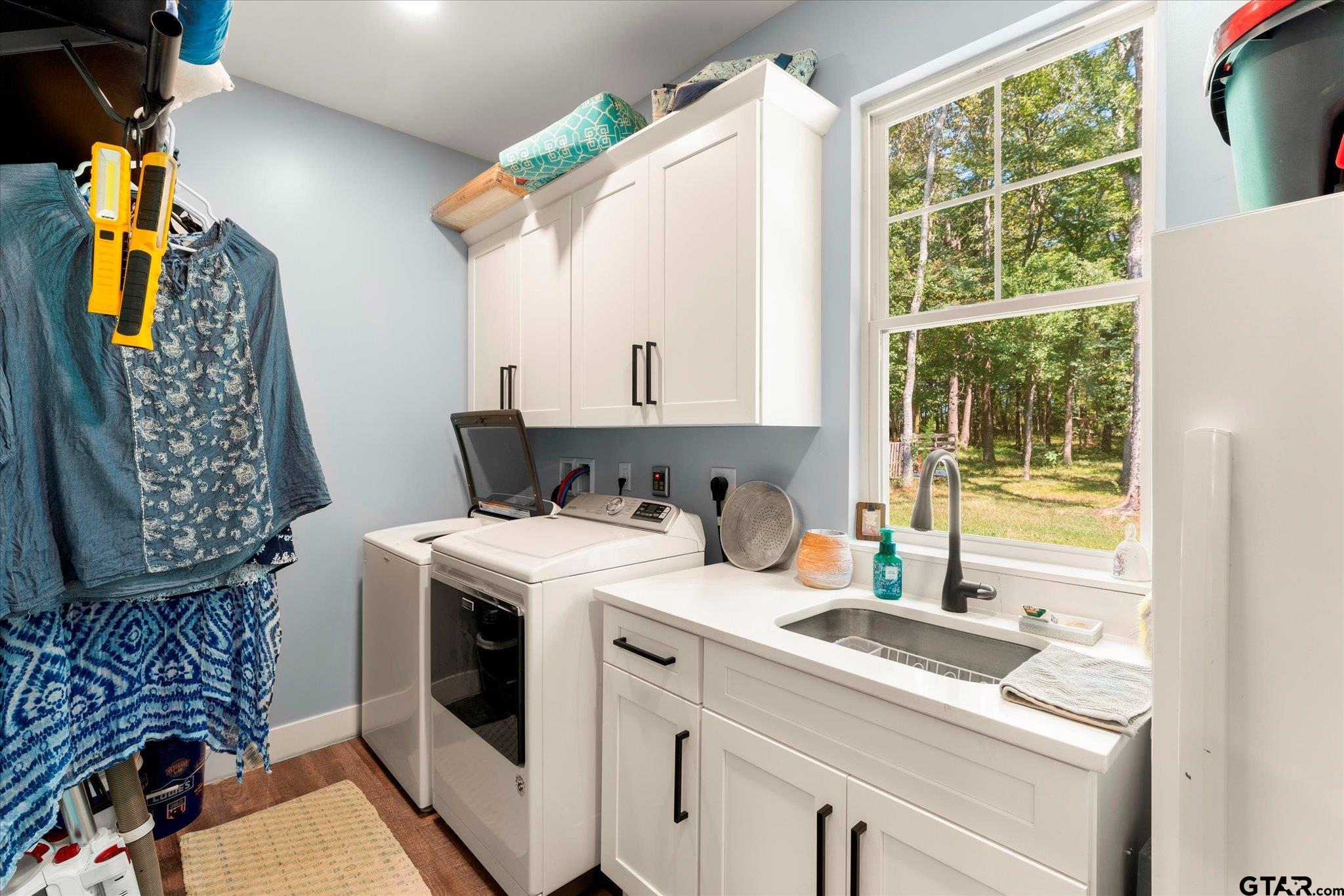1663 County Road 4510 Pittsburg, TX 75686 - Photo 28 of 34 a view of washer and dryer near a window