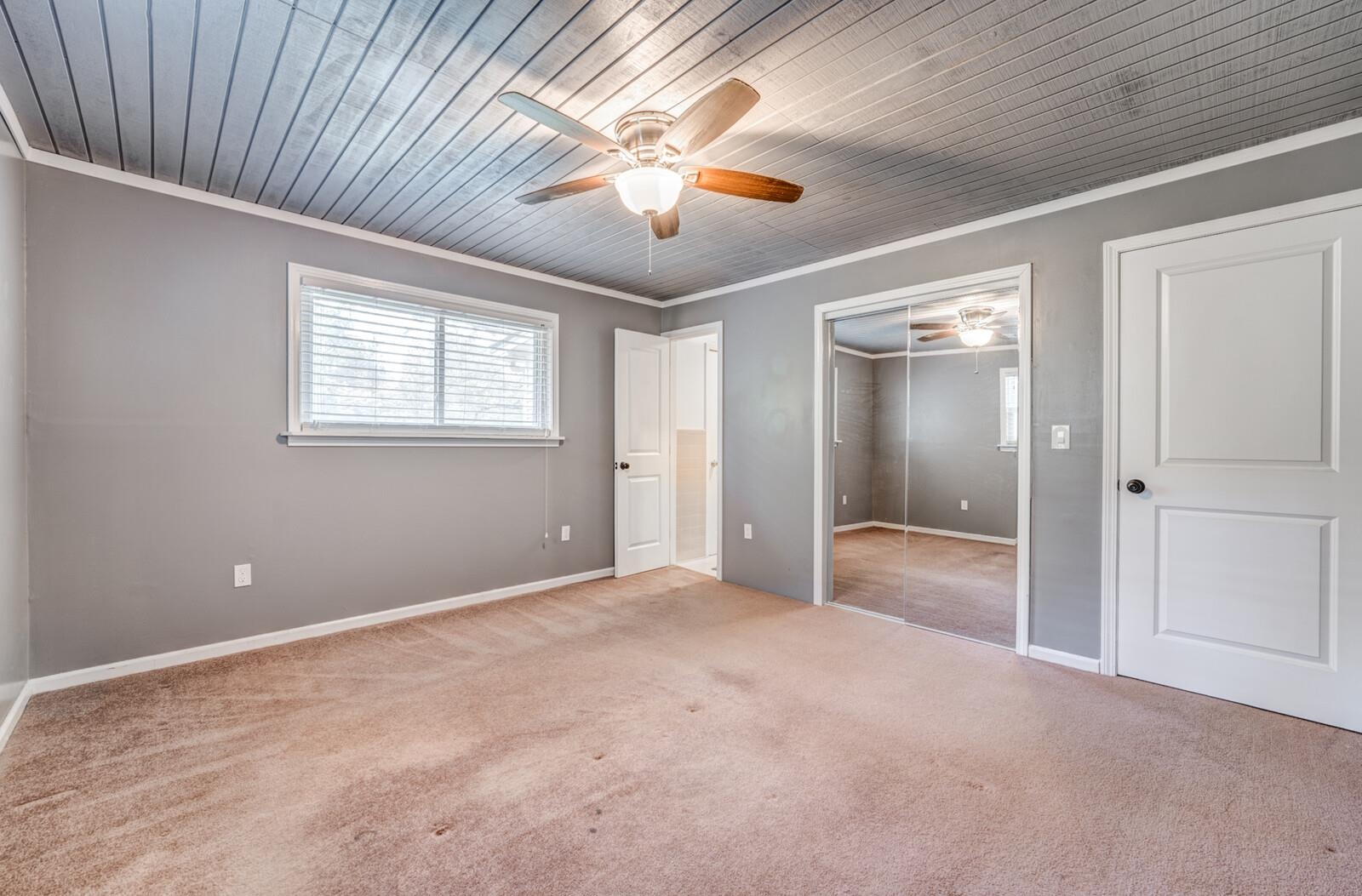 6125 Warren Road Oakland, TN 38060 - Photo 22 of 40 Room featuring gray walls, light brown carpet, and a wood-paneled ceiling