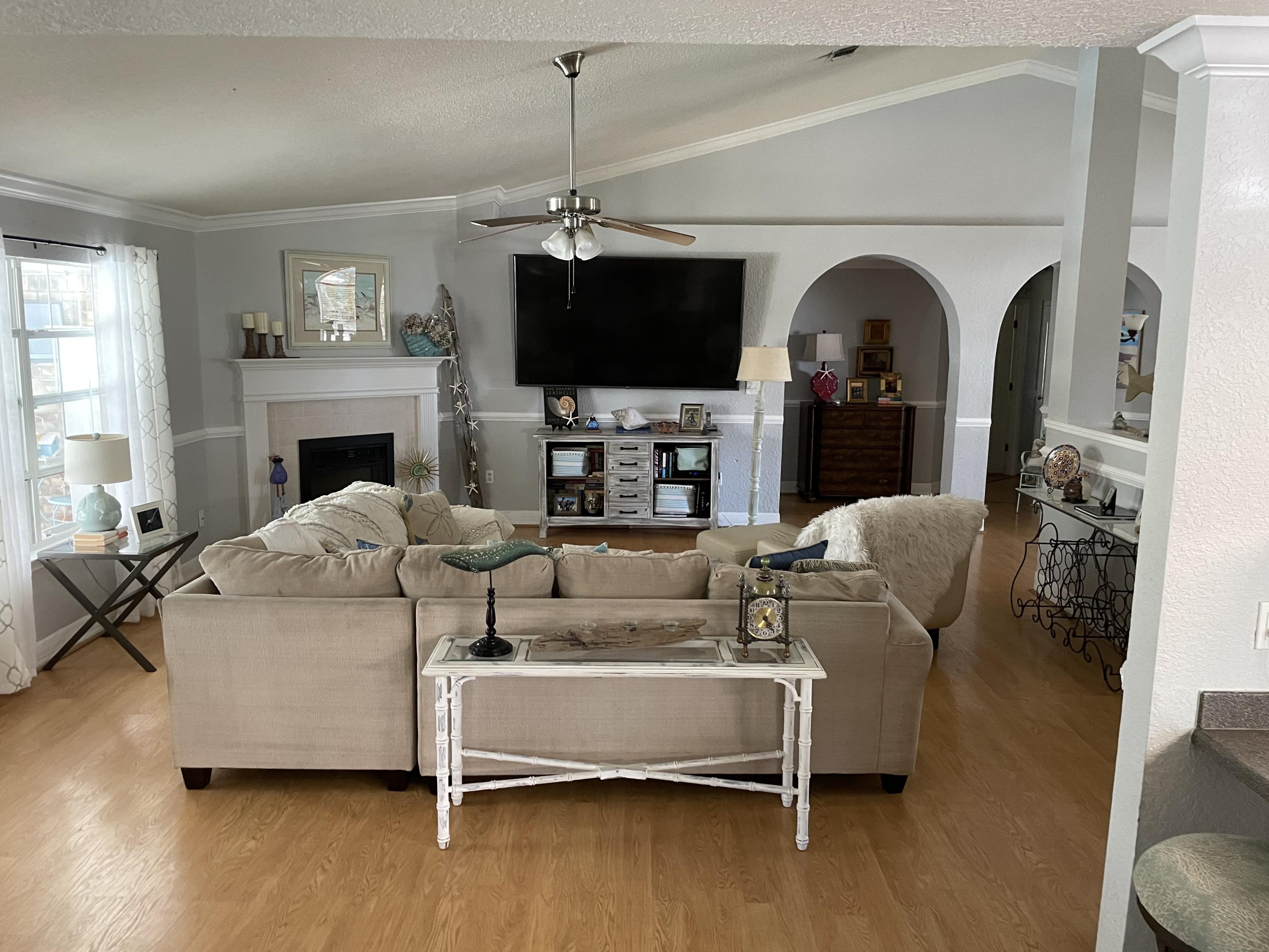 714 Driftwood Point Road Santa Rosa Beach, FL 32459 - Photo 5 of 7 a living room with furniture and a flat screen tv