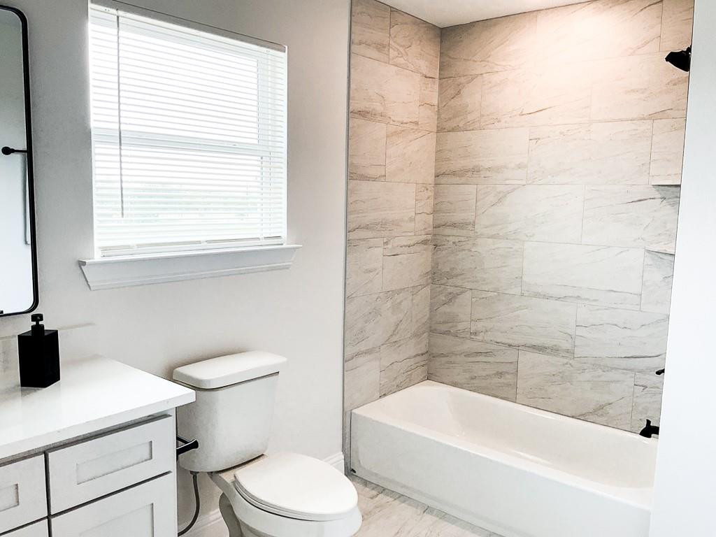 201 Bluff Court Godley, TX 76044 - Photo 16 of 17 a bathroom with a bathtub and sink