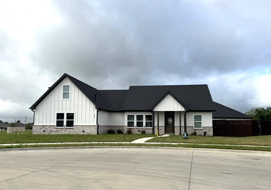 201 Bluff Court Godley, TX 76044 - Photo 2 of 17 a front view of a house with a yard